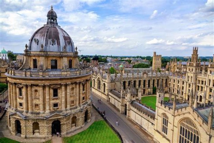 When did oxford colleges became coeducational?